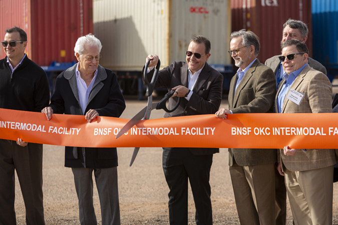 BNSF Executive Vice President and Chief Marketing Officer Tom Williams cuts the ribbon at the opening ceremony for BNSF's new intermodal facility in Oklahoma City.