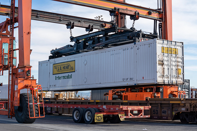 An RTG crane moves a J.B. Hunt container at BNSF’s San Bernardino Intermodal Facility in California.